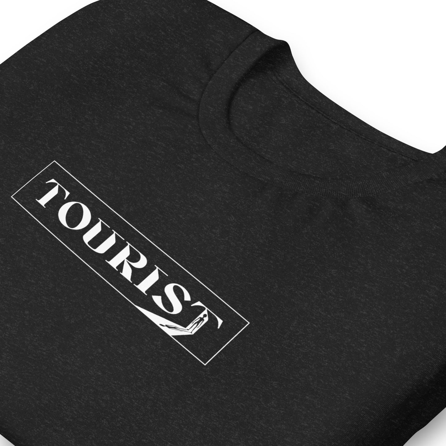 close up of Dark gray color heather tee with the word Tourist in a rectangle with an alien