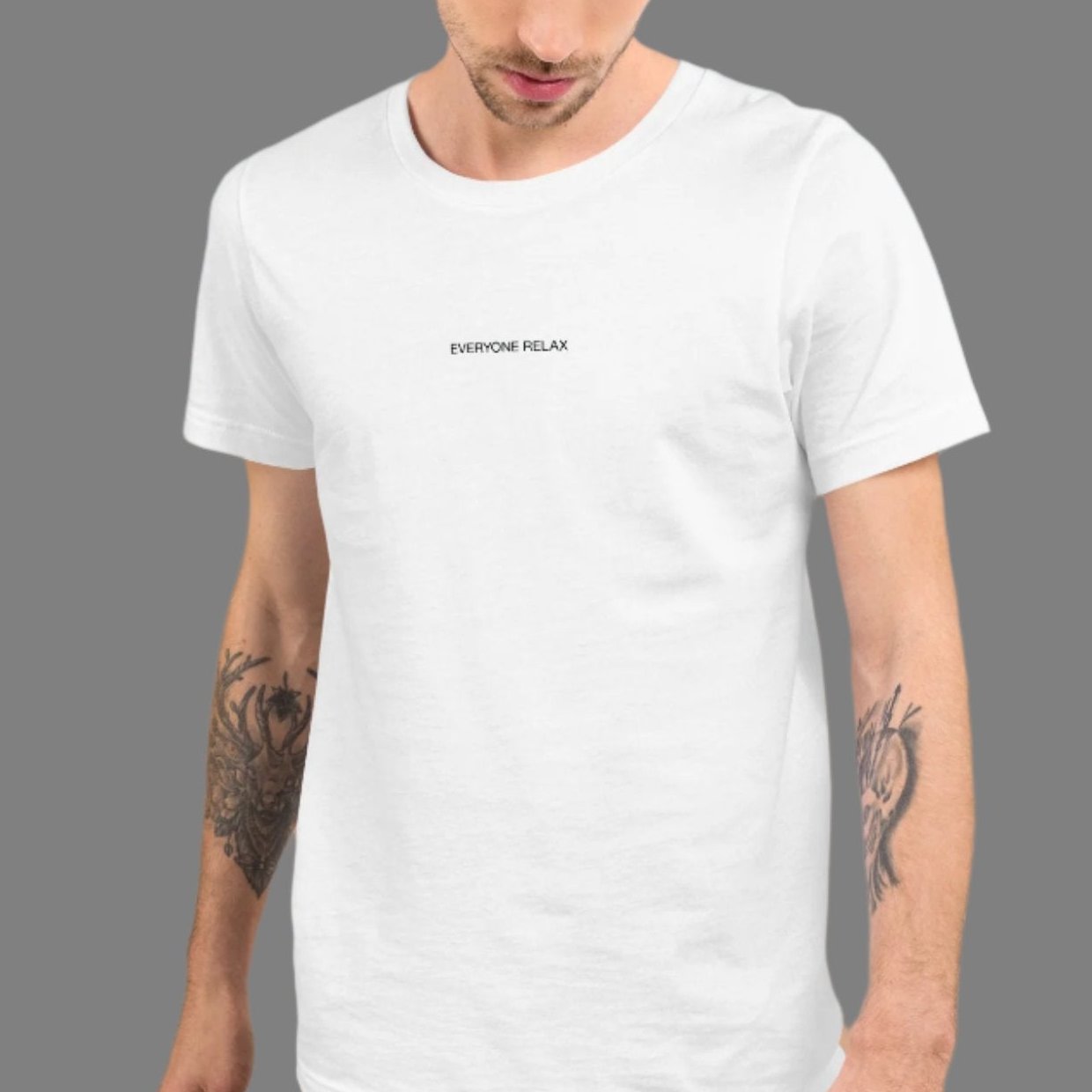 White cotton tee with the small words Everyone Relax on a male model