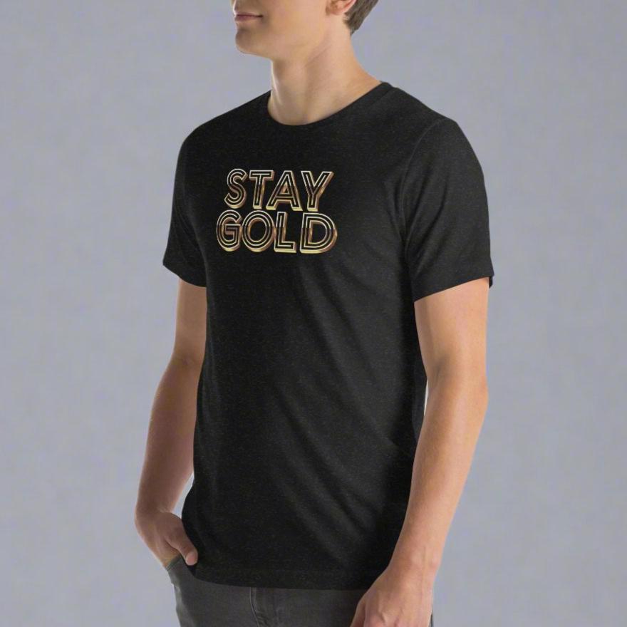 Heathered black short-sleeved tee with the words Stay Gold across the front in gold, dimensional type on model