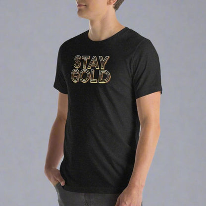 Heathered black short-sleeved tee with the words Stay Gold across the front in gold, dimensional type on model