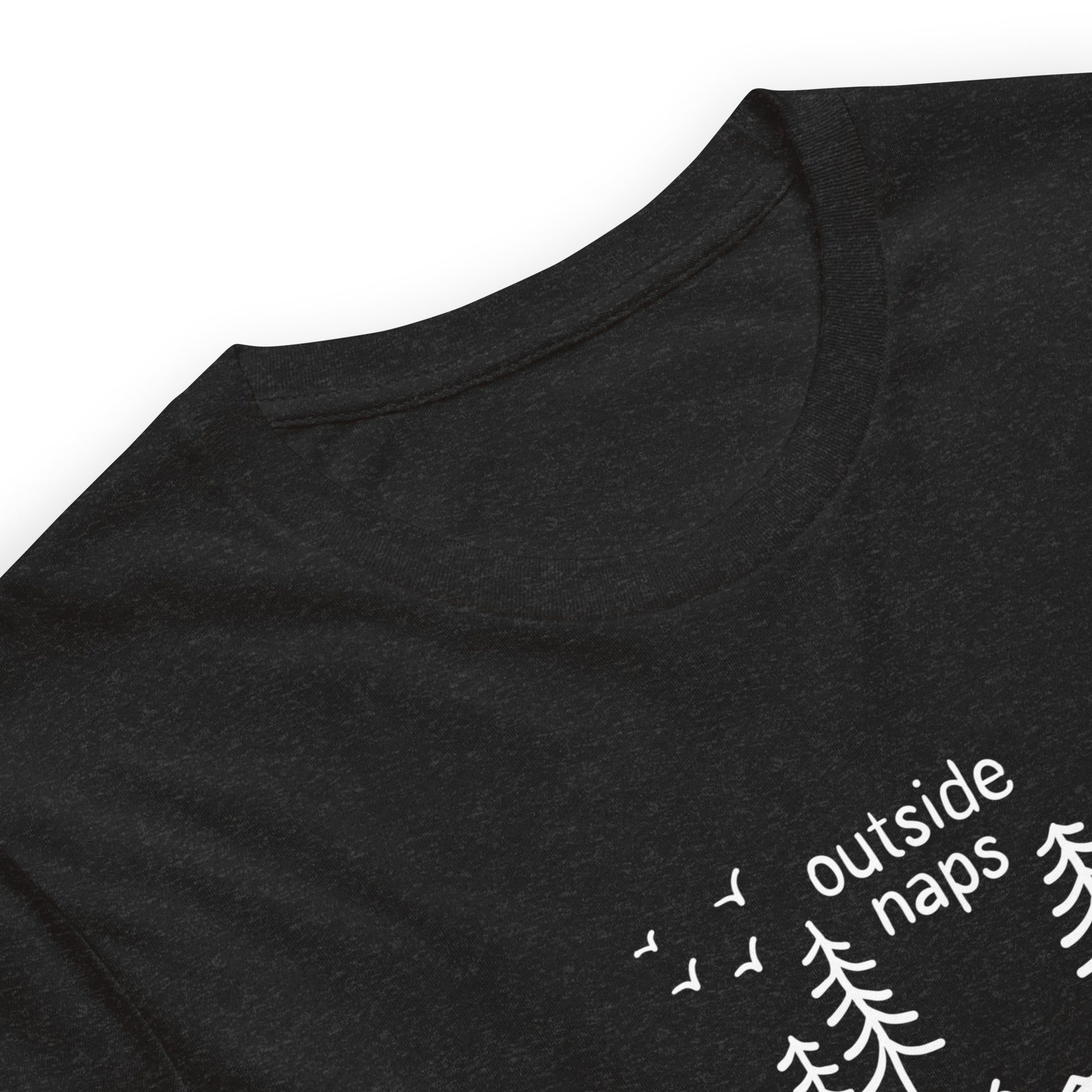 close up of Black heather tee with hand-drawn illustration of a person laying in a hammock in the trees in white