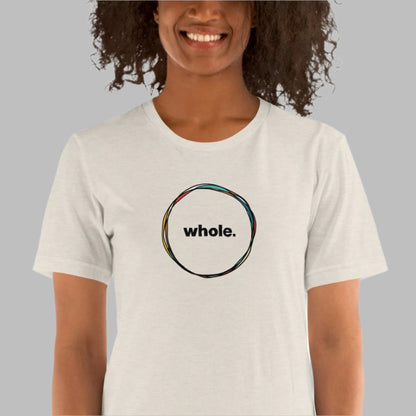 off-white color heather tee with a hand-drawn circle with the word, whole, in the middle on a model