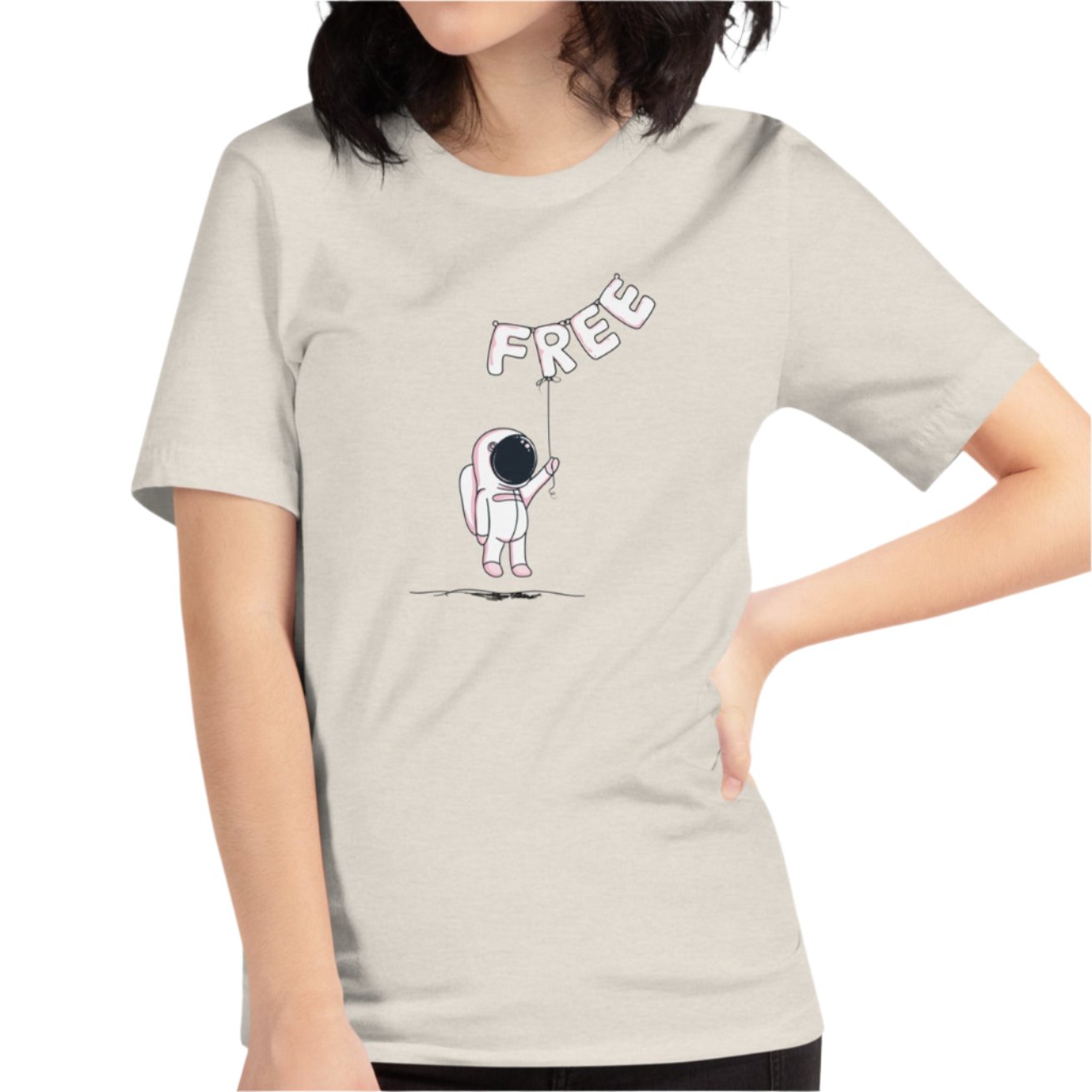 Heather dust color tee with an alien holding balloons that spell the word free on female model