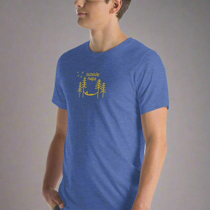 Royal blue color heather shirt with a yellow hand drawn illustration of someone laying in a hammock in the trees on male model