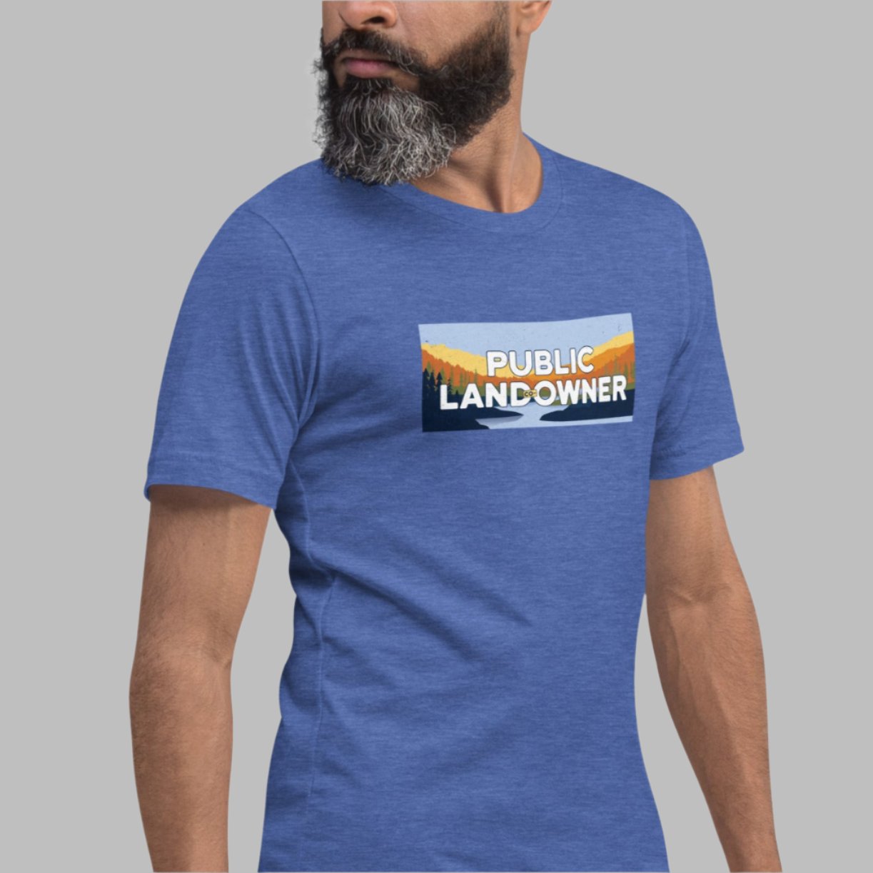 Royal blue color heather tee with a rectangle landscape saying Public land co-owner inside on male model