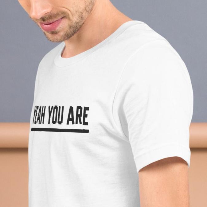 white cotton tee with electric tape lettering that reads, Yeah You Are on model