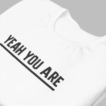 close up of white cotton tee with electric tape lettering that reads, Yeah You Are